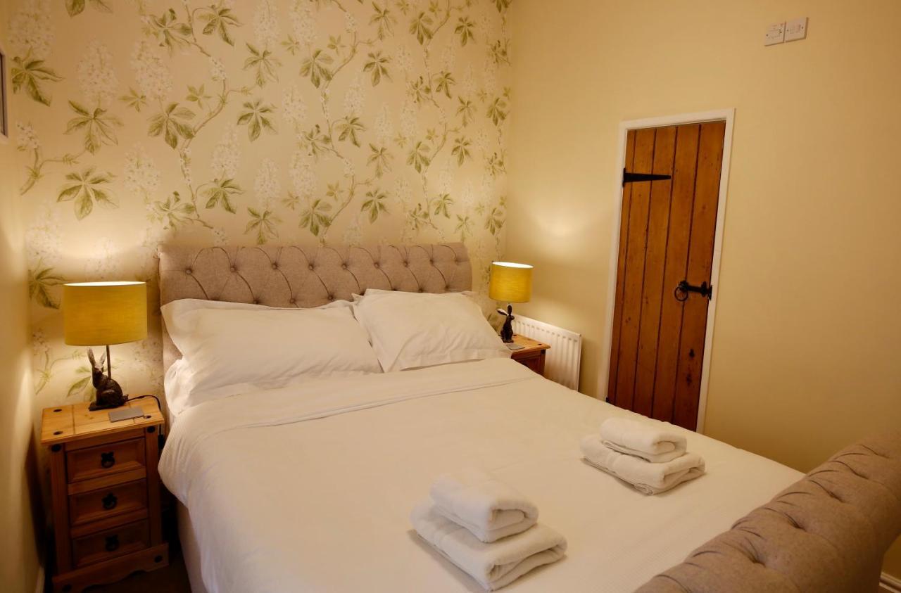 Ashfield House Hotell Grassington Rom bilde A bedroom at the Old Post Office